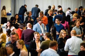 Group of people mingling at the Investing in Circularity and Sustainability event
