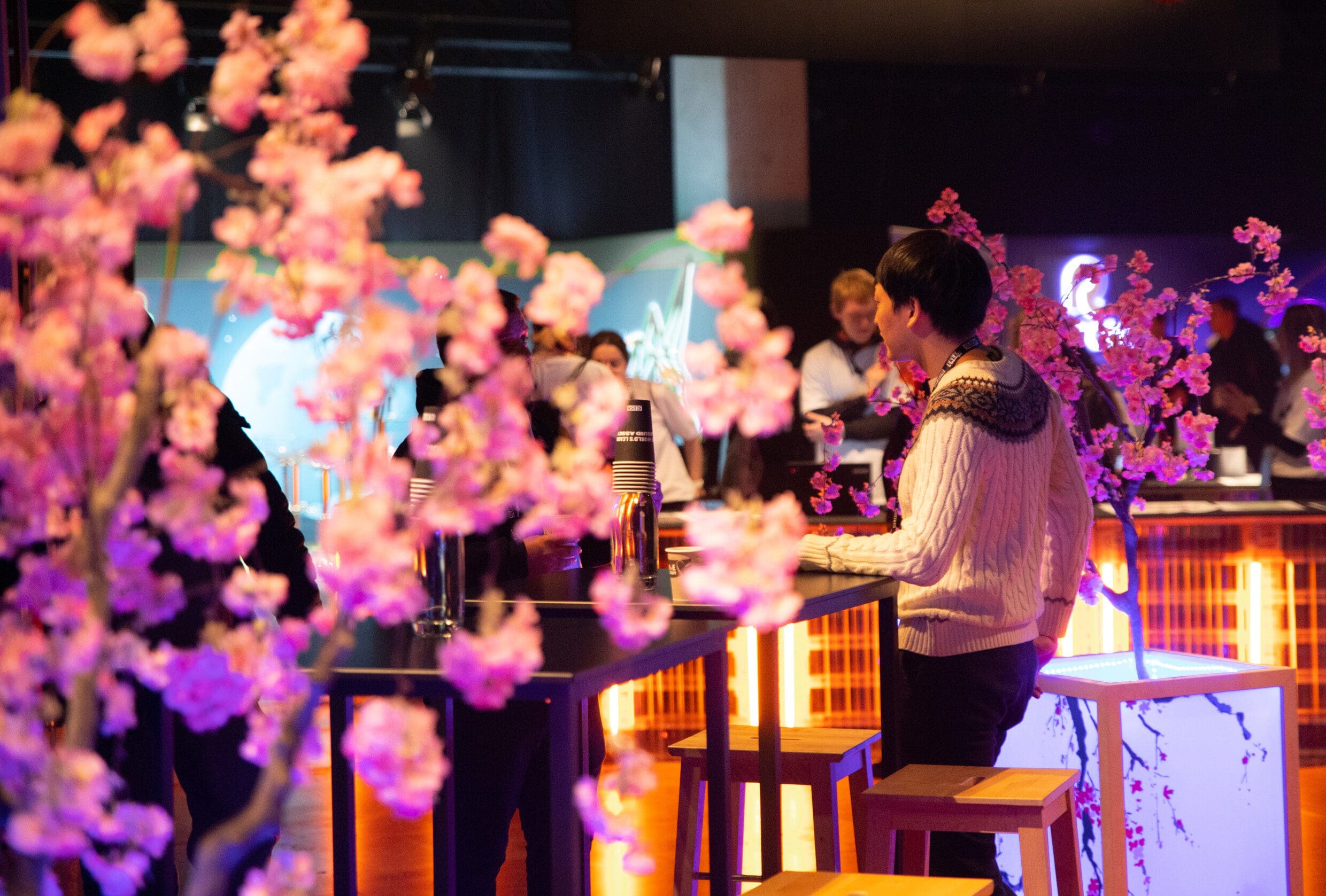 Man networking at the Fukuoka booth at Slush 2022