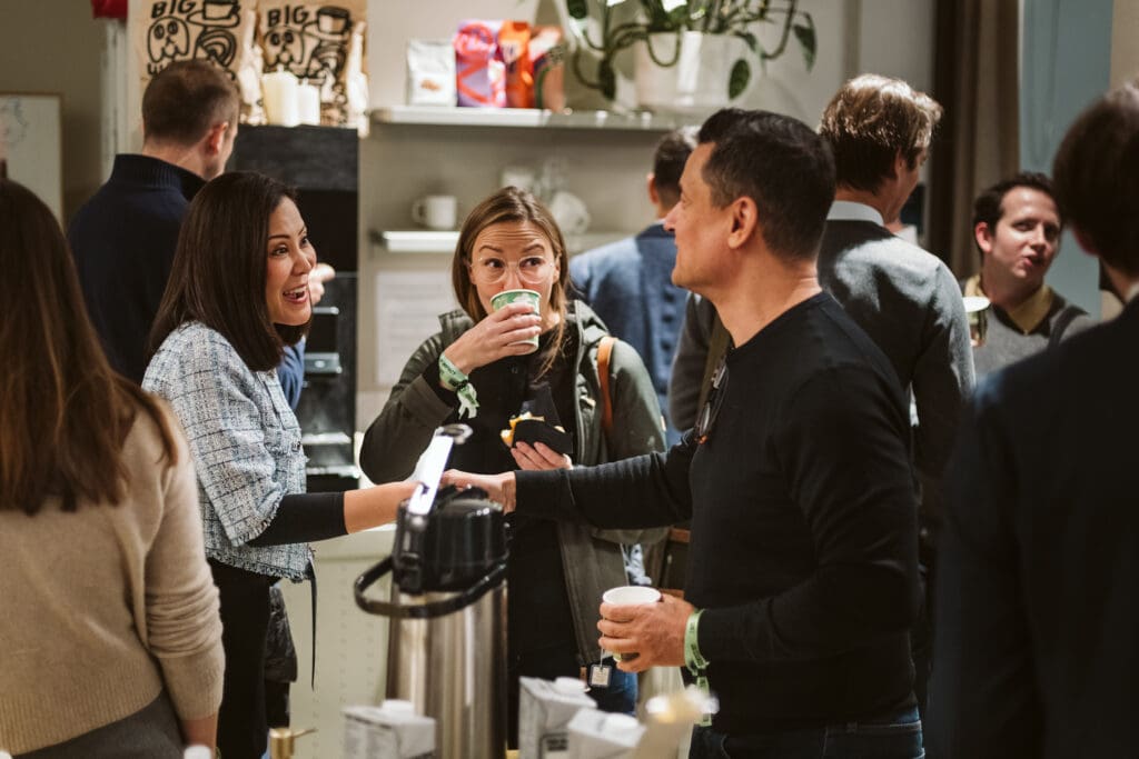 Mingling and drinks at House of Impact event.