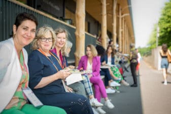 Group of women at an event smiling at the camera